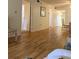 Spacious living room with wood floors and access to bedrooms or bathrooms at 3534 Lake Bayshore Dr # 118, Bradenton, FL 34205