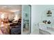 Inviting living room with glass sliding doors leading to a comfy patio with wicker furniture at 3534 Lake Bayshore Dr # 118, Bradenton, FL 34205