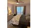 Comfortable main bedroom offering a closet, and sliding glass door to the patio at 3534 Lake Bayshore Dr # 118, Bradenton, FL 34205
