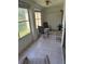 Enclosed patio offering tranquil views, furnished with comfortable seating and tile floors at 3534 Lake Bayshore Dr # 118, Bradenton, FL 34205