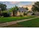 Charming home boasts lush landscaping, arched entryway, and a well-maintained lawn at 3703 Treeline Dr, Valrico, FL 33596