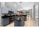Modern kitchen featuring stainless steel appliances, dark granite countertops, and tile flooring at 3703 Treeline Dr, Valrico, FL 33596