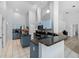 Spacious kitchen with blue cabinets, granite countertops, stainless steel appliances, and tile flooring at 3703 Treeline Dr, Valrico, FL 33596
