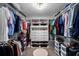 Large walk-in closet with ample shelving, drawers, and hanging space at 3703 Treeline Dr, Valrico, FL 33596