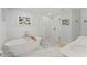 Bright bathroom featuring double vanity, a glass enclosed shower, and a soaker tub at 37309 Fountain Rd, Zephyrhills, FL 33542