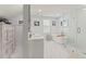 Bright bathroom featuring double vanity, a glass enclosed shower, and a soaker tub at 37309 Fountain Rd, Zephyrhills, FL 33542