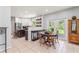 Open concept dining area adjacent to a spacious kitchen and patio access at 37309 Fountain Rd, Zephyrhills, FL 33542