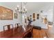 Dining room featuring a chandelier, decor, and view of the stairs at 37309 Fountain Rd, Zephyrhills, FL 33542