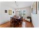 Dining room featuring hardwood floors, classic decor, and abundant natural light at 37309 Fountain Rd, Zephyrhills, FL 33542