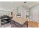 Spacious kitchen featuring stainless steel appliances, a center island, and modern finishes at 37309 Fountain Rd, Zephyrhills, FL 33542