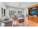Inviting living room features hardwood floors, neutral colors, and a built-in entertainment center at 37309 Fountain Rd, Zephyrhills, FL 33542