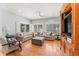 Comfortable living room features hardwood floors, neutral colors, and abundant natural light at 37309 Fountain Rd, Zephyrhills, FL 33542