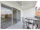 Balcony with seating and sliding glass doors to the living area at 3789 46Th S Ave # 204, St Petersburg, FL 33711