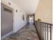 Well-maintained hallway with stone accents, leading to the condo unit's entrance at 3789 46Th S Ave # 204, St Petersburg, FL 33711