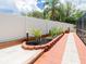 Well-maintained backyard with charming landscaping and a privacy fence, offering a serene outdoor space at 382 Florian Way, Spring Hill, FL 34609