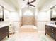 Bright bathroom features dual vanities, soaking tub, and plenty of natural light at 382 Florian Way, Spring Hill, FL 34609