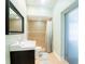 Clean bathroom with a walk-in shower, modern vanity, and neutral tile at 382 Florian Way, Spring Hill, FL 34609