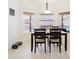 Eat-in dining area with natural light, view of the pool and lanai, and seating for four at 382 Florian Way, Spring Hill, FL 34609