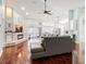 Spacious living room with fireplace, high ceilings, and view of the pool area at 382 Florian Way, Spring Hill, FL 34609