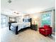 Spacious main bedroom featuring cool colors, a ceiling fan, and sliding glass doors at 382 Florian Way, Spring Hill, FL 34609