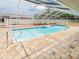 Screened-in pool area features brick paver flooring at 382 Florian Way, Spring Hill, FL 34609