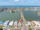 Scenic aerial shot of a waterfront property with street access, perfect for coastal living at 399 161St Ave, Redington Beach, FL 33708