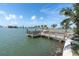 A private dock extends into the tranquil bay waters, providing a serene waterfront experience at 399 161St Ave, Redington Beach, FL 33708