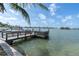Private dock on tranquil water, ideal for boating and enjoying waterfront living at 399 161St Ave, Redington Beach, FL 33708