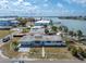 A waterfront home with an expansive backyard and private dock, perfect for enjoying the waterfront lifestyle at 399 161St Ave, Redington Beach, FL 33708