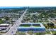 Panoramic view of the condo complex situated within a vibrant city, lush landscapes and ocean in the background at 4050 4Th N St # 205, St Petersburg, FL 33703