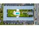 Aerial view of the U shaped condo with central recreational area including pool and shuffleboard court at 4050 4Th N St # 205, St Petersburg, FL 33703
