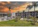 Beautiful condo complex featuring a pool, shuffleboard court, and lush landscaping at 4050 4Th N St # 205, St Petersburg, FL 33703