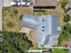 Aerial view of home with a gray roof and well-maintained landscaping at 4203 W Cleveland St, Tampa, FL 33609