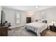 Cozy bedroom with neutral tones, plush carpeting, and plantation shutters for natural light at 4203 W Cleveland St, Tampa, FL 33609