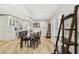 Dining area with bright natural light, light wood floors, and built in bar with wine fridge at 4203 W Cleveland St, Tampa, FL 33609