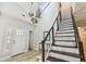 Stunning foyer with high ceilings, modern staircase, and decorative pendant lighting at 4203 W Cleveland St, Tampa, FL 33609