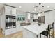Modern kitchen features stainless appliances, white cabinets, large window, and island seating at 4203 W Cleveland St, Tampa, FL 33609