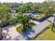 Aerial view of property featuring a long driveway, mature landscaping, and backyard oasis with pool and covered patio at 4301 S Lockwood Ridge Rd, Sarasota, FL 34231