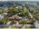 Aerial view of the property showcasing the home, pool, and meticulously landscaped yard at 4301 S Lockwood Ridge Rd, Sarasota, FL 34231