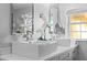 The bathroom boasts dual vessel sinks, modern fixtures, and plenty of counter space at 4301 S Lockwood Ridge Rd, Sarasota, FL 34231