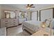 A well-lit bedroom with queen bed, a dresser and a window at 4301 S Lockwood Ridge Rd, Sarasota, FL 34231
