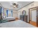 Bright bedroom featuring twin beds, hardwood floors, natural light, and a dresser at 4301 S Lockwood Ridge Rd, Sarasota, FL 34231