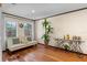 Bonus room featuring hardwood floors, large windows, comfortable seating and a bar cart at 4301 S Lockwood Ridge Rd, Sarasota, FL 34231
