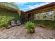 Charming courtyard with brick pavers, lush greenery, and a peaceful ambiance at 4301 S Lockwood Ridge Rd, Sarasota, FL 34231