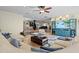 Inviting open-concept living room boasts bright decor, hardwood floors, and an open floor plan at 4301 S Lockwood Ridge Rd, Sarasota, FL 34231