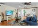 Cozy living room with hardwood floors, stylish decor, and seamless access to the adjacent room at 4301 S Lockwood Ridge Rd, Sarasota, FL 34231