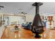 Open living room with wood floors, fireplace, and French doors offers a cozy, inviting space at 4301 S Lockwood Ridge Rd, Sarasota, FL 34231
