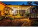 Enclosed patio with backyard landscape at 4301 S Lockwood Ridge Rd, Sarasota, FL 34231