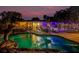 Backyard pool with a dolphin water feature and exterior view of the house with backyard at 4301 S Lockwood Ridge Rd, Sarasota, FL 34231