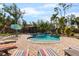 Backyard pool featuring an outdoor gazebo and lush landscaping at 4301 S Lockwood Ridge Rd, Sarasota, FL 34231